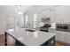 Beautiful kitchen island with new countertops, stainless steel appliances, and bright lighting at 713 Catherine Lake Ct, Fuquay Varina, NC 27526