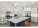 Stylish kitchen with quartz countertops, stainless appliances, and center island at 713 Catherine Lake Ct, Fuquay Varina, NC 27526