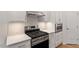 Well-lit kitchen with stainless steel range and microwave at 713 Catherine Lake Ct, Fuquay Varina, NC 27526