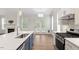 Modern kitchen features stainless steel appliances, ample counter space, and an island perfect for entertaining at 713 Catherine Lake Ct, Fuquay Varina, NC 27526