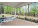 Relaxing screened-in porch providing a great view of the lush, green landscaped backyard at 713 Catherine Lake Ct, Fuquay Varina, NC 27526