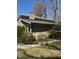 A charming home exterior featuring a brick chimney and window features at 748 Currituck Dr, Raleigh, NC 27609