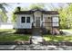Charming home with front porch, well-maintained lawn, and traditional architectural details at 808 Grace Ave, Burlington, NC 27217