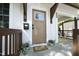 Close-up of the front door and porch, highlighting the secure keypad and lovely plants at 808 Grace Ave, Burlington, NC 27217