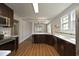 Open concept kitchen with stainless appliances, quartz countertops, and modern lighting at 808 Grace Ave, Burlington, NC 27217