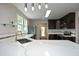 Kitchen showcasing a quartz countertop, stainless steel appliances, and dark cabinetry at 808 Grace Ave, Burlington, NC 27217