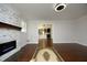 Open living room features a stone fireplace and view to the kitchen at 808 Grace Ave, Burlington, NC 27217