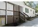 Exterior showing the side and rear of the house, deck, and the well-kept backyard at 808 Grace Ave, Burlington, NC 27217