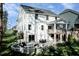 Sprawling backyard featuring a stone fire pit, patio, outdoor furniture and string lights at 809 Walker Ridge Way, Willow Springs, NC 27592