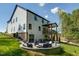 Multi-level backyard with outdoor seating, a patio, and a built in fire pit at 809 Walker Ridge Way, Willow Springs, NC 27592