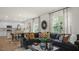 Spacious living room that opens to a kitchen and dining area, featuring an oversized sofa at 812 Canis Minor Rd, Wendell, NC 27591