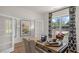 Well-lit home office with French doors, a wooden desk, and views of the outdoors at 812 Canis Minor Rd, Wendell, NC 27591
