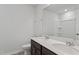 Bathroom featuring double sinks, a modern mirror and fixtures, and tiled floors at 84 Grove Township Way, Angier, NC 27501