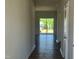 Inviting entryway with modern flooring and a view of the backyard and deck through large glass doors at 84 Grove Township Way, Angier, NC 27501