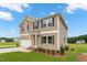 Beautiful home featuring neutral siding, a two-car garage, and a neatly landscaped front yard at 84 Grove Township Way, Angier, NC 27501