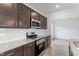 New kitchen featuring stainless appliances, granite countertops and a subway tile backsplash at 84 Grove Township Way, Angier, NC 27501
