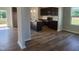 Modern kitchen featuring an island with granite countertops, stainless steel appliances, and dark cabinetry at 84 Grove Township Way, Angier, NC 27501