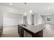 New kitchen island featuring stainless sink, granite countertop, dishwasher and wood cabinets at 84 Grove Township Way, Angier, NC 27501
