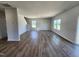 Spacious living room with hardwood flooring and large windows for ample natural light at 84 Grove Township Way, Angier, NC 27501