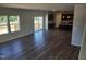 Bright open-concept space with a modern kitchen and a living room with sliding glass doors to the deck at 84 Grove Township Way, Angier, NC 27501