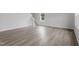 Bright, open living space with modern flooring, staircase, and fresh white walls with natural light at 84 Grove Township Way, Angier, NC 27501