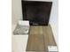 Flagstone cabinet door with a luxurious blend of River Falls Granite and Heardsville Plus Driftwood flooring samples at 84 Grove Township Way, Angier, NC 27501