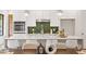 Bright kitchen with stainless steel appliances, quartz countertops, and stylish pendant lighting at 1007 E Davie St, Raleigh, NC 27601