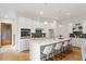 Bright kitchen with stainless steel appliances, quartz countertops, and stylish pendant lighting at 1007 E Davie St, Raleigh, NC 27601