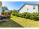 Manicured backyard featuring lush lawn, a well-maintained deck, and a patio at 101 Vista Brooke Dr, Morrisville, NC 27560