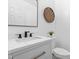 Modern powder room featuring a vessel sink, black faucet, and a framed mirror at 101 Vista Brooke Dr, Morrisville, NC 27560