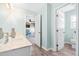 Bright bathroom featuring a marble countertop, light blue walls, and wood-look floors at 101 Vista Brooke Dr, Morrisville, NC 27560