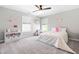 Charming bedroom with natural light, light grey walls, and a ceiling fan at 101 Vista Brooke Dr, Morrisville, NC 27560