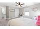 Cozy bedroom with large bed, natural light, and adjacent bathroom doorway at 101 Vista Brooke Dr, Morrisville, NC 27560