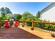 Spacious wooden deck with backyard views and comfortable red chairs at 101 Vista Brooke Dr, Morrisville, NC 27560