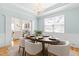 Bright dining room featuring stylish decor, wainscoting, chandelier, and seating for six at 101 Vista Brooke Dr, Morrisville, NC 27560