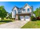 Stately two-story home with stone accents, a bay window, and a two-car garage at 101 Vista Brooke Dr, Morrisville, NC 27560
