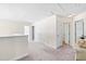 Hallway with neutral carpet, white walls, three doors, and overhead lighting at 101 Vista Brooke Dr, Morrisville, NC 27560