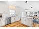 Open concept kitchen featuring white cabinets, stainless appliances and spacious island seating at 101 Vista Brooke Dr, Morrisville, NC 27560