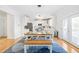 Bright and modern kitchen features white cabinets, stainless appliances, and an adjacent dining area at 101 Vista Brooke Dr, Morrisville, NC 27560