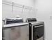 Spacious laundry room with LG washer and dryer and wire rack shelving at 101 Vista Brooke Dr, Morrisville, NC 27560