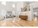 Bright living room with hardwood floors, neutral decor, and a soaring two-story ceiling at 101 Vista Brooke Dr, Morrisville, NC 27560