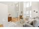 Airy living room featuring high ceilings, large windows, modern decor and lots of natural light at 101 Vista Brooke Dr, Morrisville, NC 27560