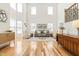 Bright living room with soaring ceilings, large windows, hardwood floors, and elegant decor at 101 Vista Brooke Dr, Morrisville, NC 27560