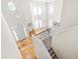High-angle view showcasing a light-filled living room, hardwood floors, and a staircase at 101 Vista Brooke Dr, Morrisville, NC 27560