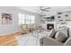 Inviting living room with a fireplace, built-in shelves, comfortable seating, and plenty of natural light at 101 Vista Brooke Dr, Morrisville, NC 27560