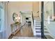 Welcoming entryway featuring hardwood floors, staircase, and stylish decor at 108 Berry Mill Ln # 132, Raleigh, NC 27603
