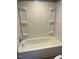 Bathroom featuring a bathtub and shower, neutral paint at 108 Virgil Rd, Durham, NC 27703