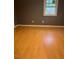 Bedroom featuring hard wood floors, neutral paint, and lots of natural light at 108 Virgil Rd, Durham, NC 27703