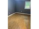 Bedroom featuring hard wood floors, neutral paint, and lots of natural light at 108 Virgil Rd, Durham, NC 27703