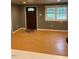 Bright living room featuring hardwood floors, neutral paint, and lots of natural light at 108 Virgil Rd, Durham, NC 27703